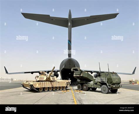 An M1 Abrams And A High Mobility Artillery Rocket System Ready