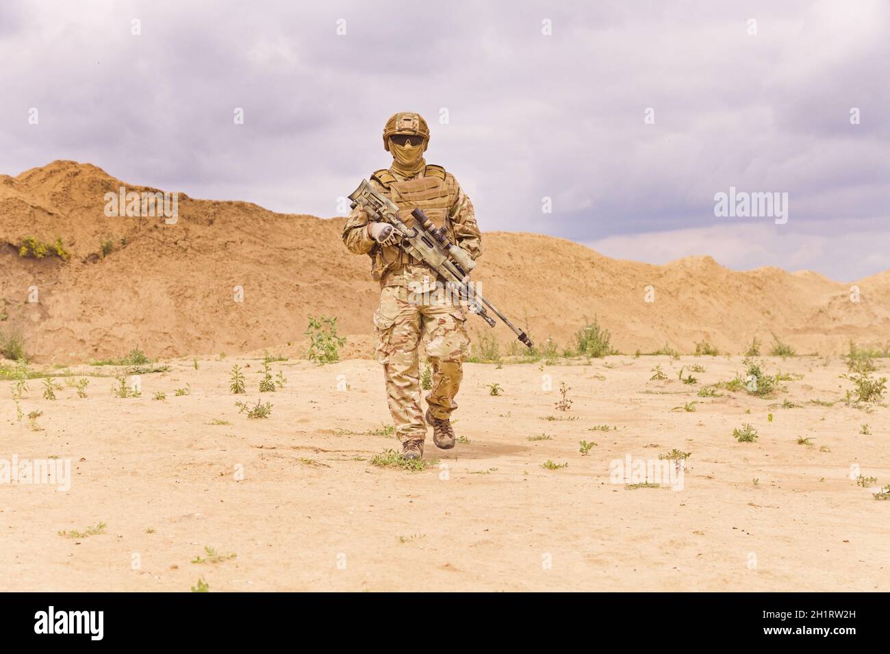 Fully Equipped And Armed Special Forces Soldier In The Desert Army