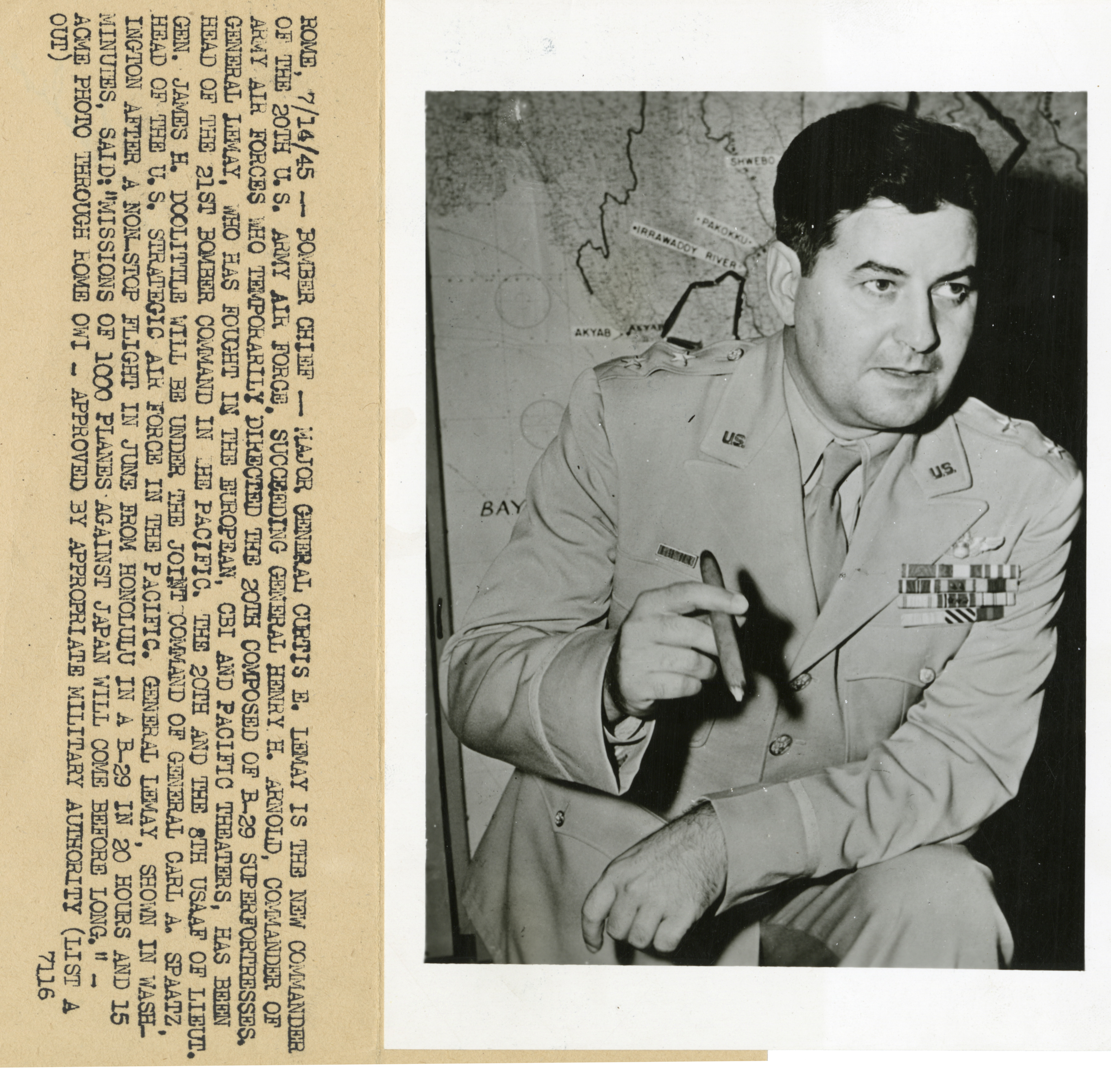 Major General Curtis E Lemay Holding Cigar And Standing Before Large