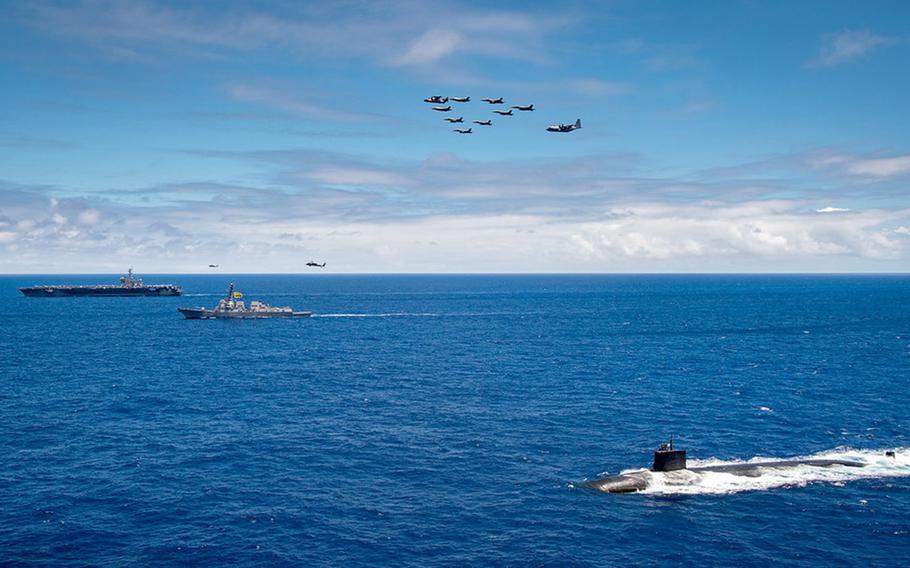 Navy And Marine Corps Aircraft Fly In Formation Above Uss Carl Vinson