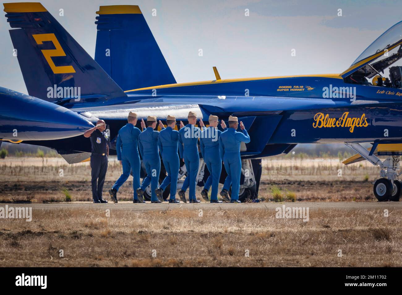 The Us Navy Blue Angel Pilots Walk On The Flight Line To Their Aircraft